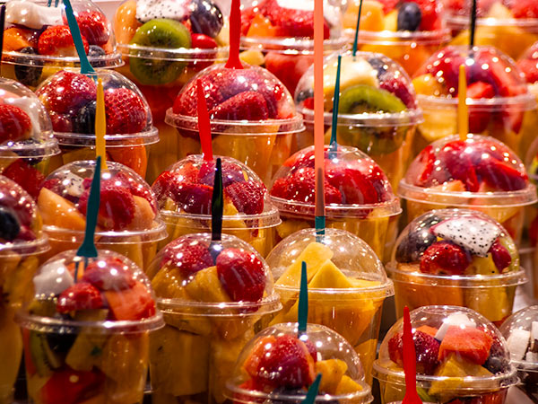Rows of fruit cups on display for sale at Barcelona marketplace