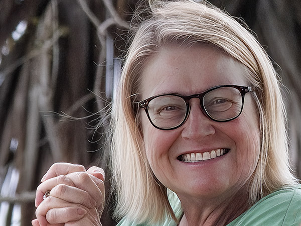 Big smiling woman looking at camera